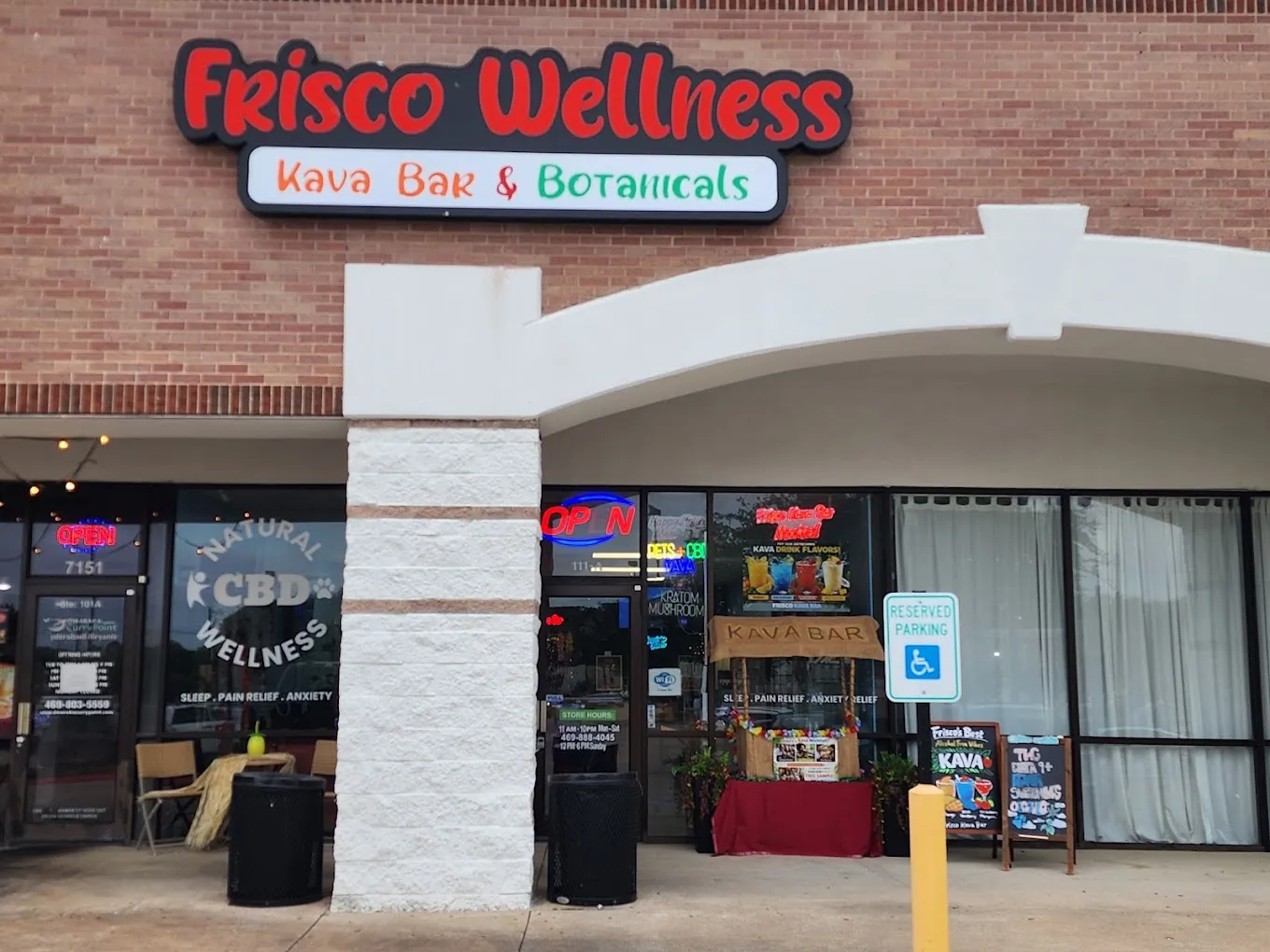 Frisco Wellness storefront featuring "Kava Bar & Botanicals" sign, showcasing wellness products and inviting atmosphere